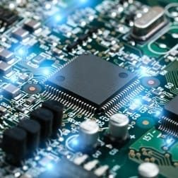 closeup-of-electronic-circuit-board-with-cpu-microchip-electronic-components-background